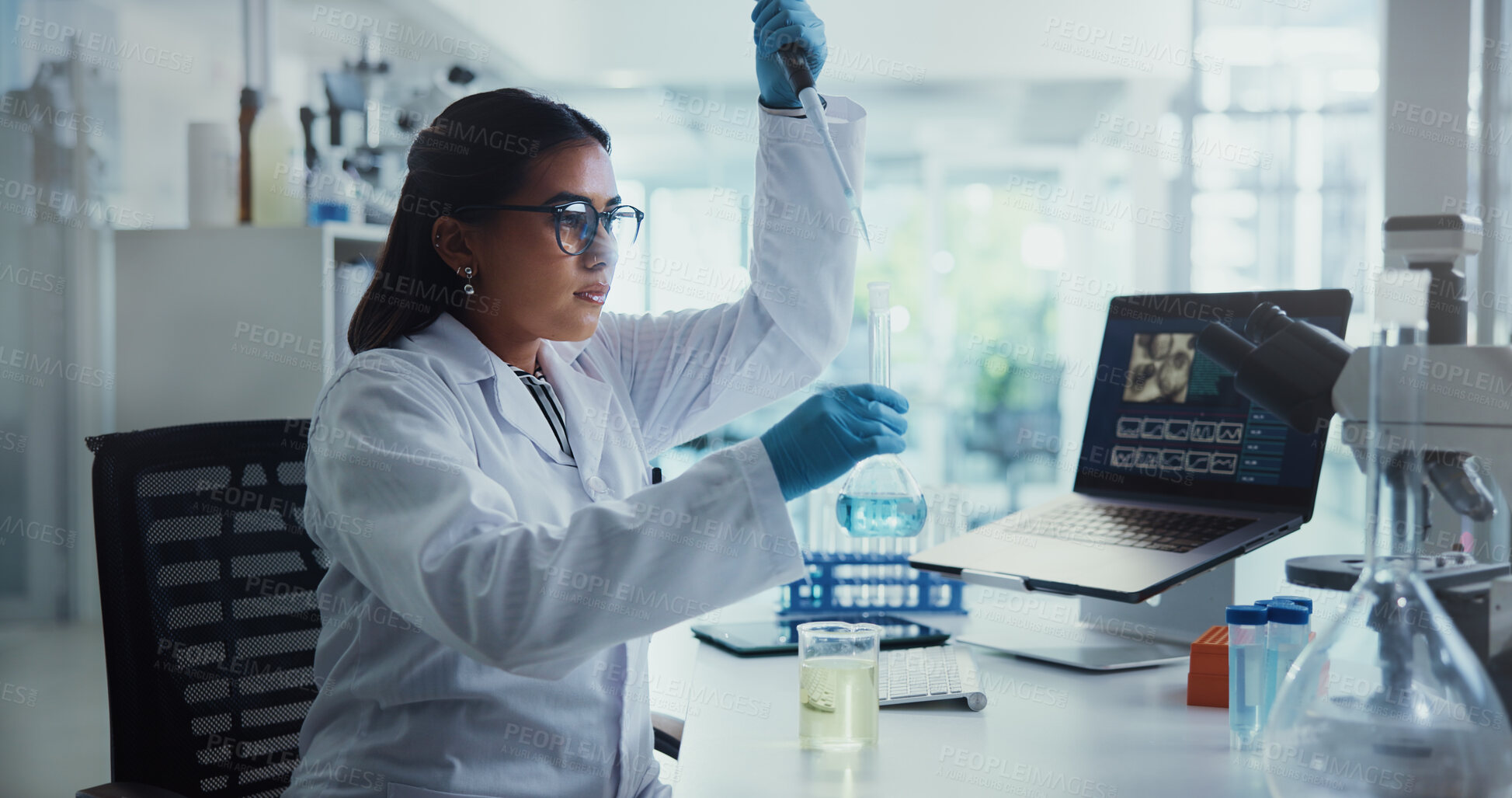 Buy stock photo Scientist, woman and laptop with beaker for chemistry, testing and medical research. Biotech, laboratory and analysis with data inspection for pharmaceutical or pathology experiment for breakthrough