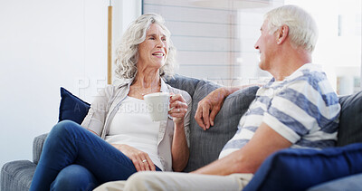 Buy stock photo Bonding, smile and senior couple with coffee, conversation and romance for relationship in living room. House, old man and woman with tea, retirement and elderly people in lounge, talking or marriage