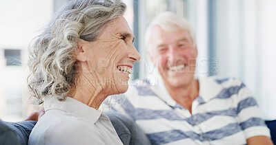 Buy stock photo Laughing, senior couple and happy in home, talking and romance for relationship in living room. House, old man and woman in retirement, comfortable and elderly people in lounge, funny or marriage