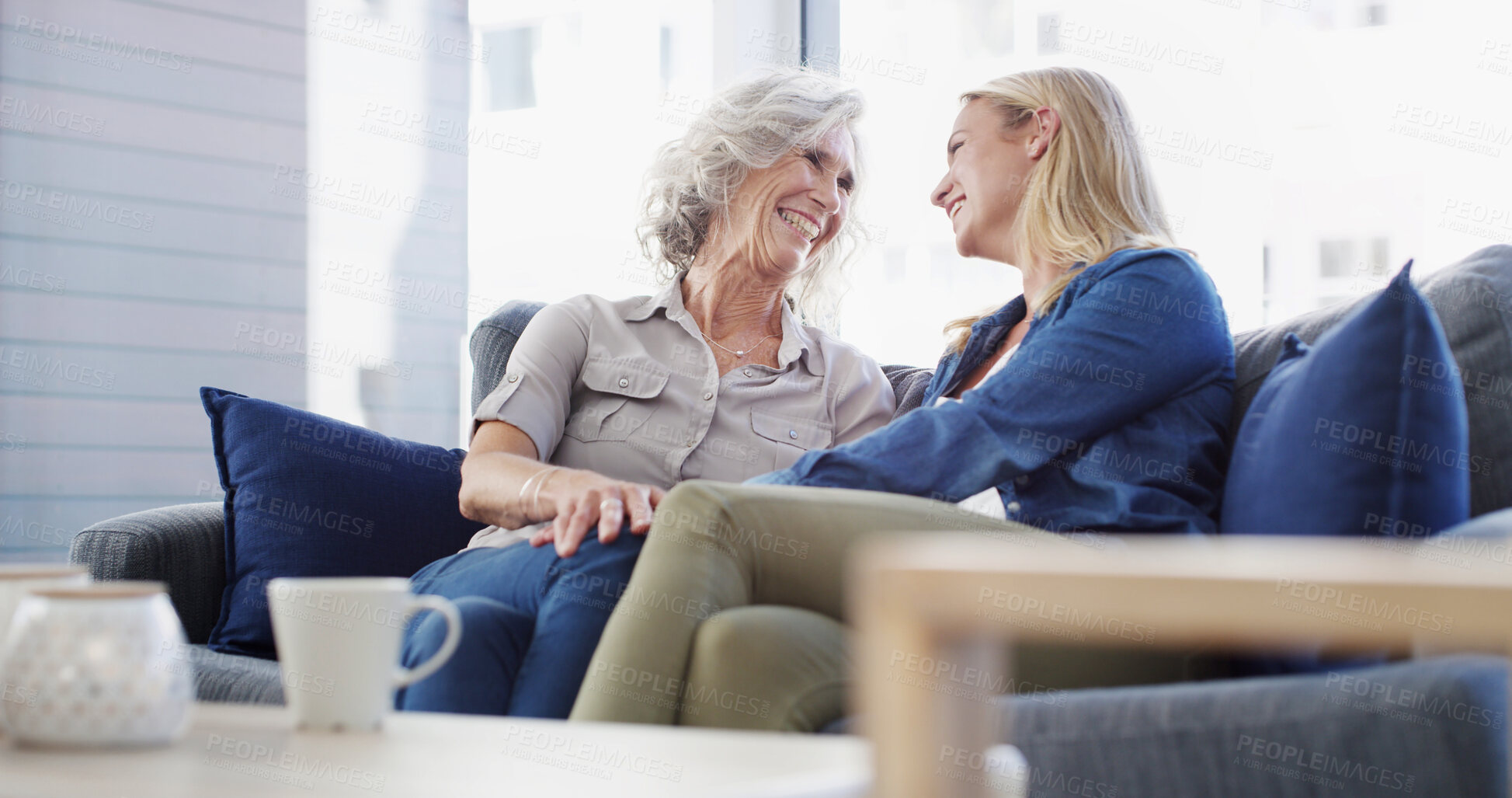 Buy stock photo Home, senior mother and daughter on sofa, conversation and bonding together in living room. Family, parent and women on couch, discussion and relax with weekend break, reunion and comfort in lounge