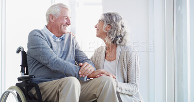 Buy stock photo Holding hands, wheelchair and senior couple in home for bonding, empathy or trust for support. Retirement, marriage and happy mature man and woman together for compassion, care or loving relationship