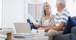 Senior, happy couple and documents with laptop on sofa for finance, budget planning or retirement annuity. Elderly man, woman or lovers with smile, computer or paperwork for pension fund or insurance