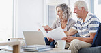 Happy, senior couple and documents with laptop for finance, budget planning or retirement annuity on sofa. Elderly man, woman or lovers with smile, computer or paperwork for pension fund or insurance