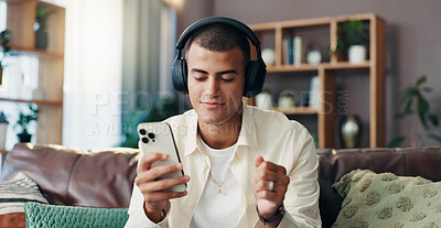 Buy stock photo Man, happy and phone with headphones on sofa for music, sound and streaming subscription in living room. Person, smile and eyes closed with smartphone, mobile app and listening on couch at apartment