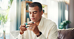 Home, sofa and man with coffee for smell, wellness and comfortable in living room on weekend morning. House, male person and aroma with relax for cappuccino, espresso and satisfaction with drink