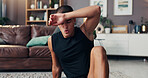 Man, exercise and tired on floor, sweat and rest in home with fitness, health and burnout in living room. Person, break and exhausted with workout, training or wellness on carpet in lounge at house