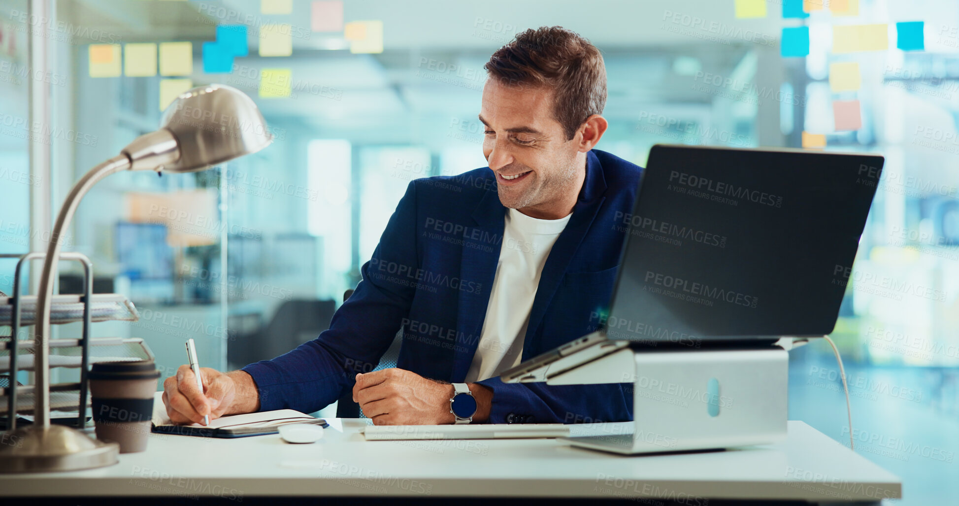 Buy stock photo Business, writing and man in office, laptop and smile with positive feedback, ideas for article and copywriting. Person, employee and journalist in workplace, pc and notes for report or brainstorming