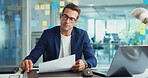 Businessman, finance or documents with laptop for statistics report or company performance at office. Man, employee or financial analyst with paperwork for business growth or analytics at workplace