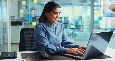 Buy stock photo Creative, woman and typing on laptop in office for news story, article research or proofreading blog. Business, journalist or happy at media agency for website publication, feedback review or editing