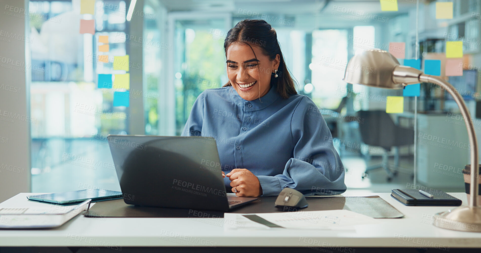 Buy stock photo Creative, excited or Indian woman on laptop in office for editor feedback, news publication or positive review. Business, happy journalist or smile at media agency for story, approval or proofreading