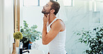 Beauty, cleaning and mirror with man in bathroom of home for hygiene or morning routine. Profile, satisfaction and skincare with happy person in apartment for grooming, inspection or shaving
