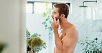 Man, face cream and bathroom with skincare for grooming, moisturizer or facial treatment at home. Male person, morning or routine with lotion, SPF or anti aging creme for cosmetics or dermatology
