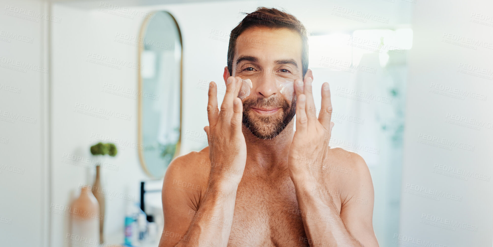 Buy stock photo Happy man, portrait or face cream with mirror for skincare, grooming or facial treatment at home. POV, male person or reflection with moisturizer, lotion or creme for anti aging cosmetics in bathroom