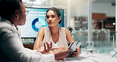 Buy stock photo Meeting, discussion and women with tablet, business and serious for mental health assistance programs. Teamwork, HR and planning for workplace wellness, communication and collaboration in boardroom
