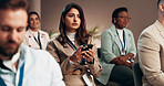 Business woman, conference and phone with audience for keynote presentation notes, listening or information. Mobile, group and seminar for learning workshop, convention meeting or corporate training