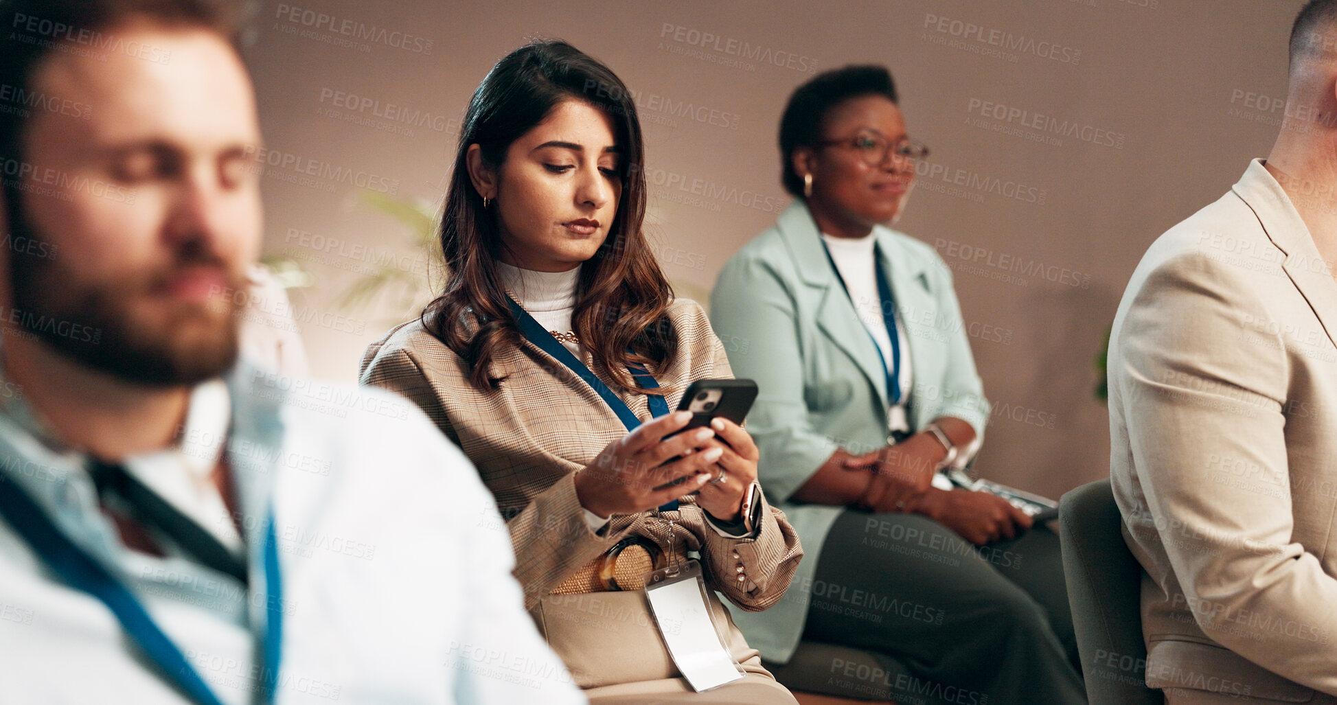 Buy stock photo Business woman, conference and mobile with audience for keynote presentation notes, listening or typing info. Phone, group and seminar for learning workshop, texting or reading at corporate training