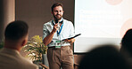Businessman, conference and training for speaker in seminar room for wellness presentation. Education, forum speech and microphone with corporate coach on stage for public relations or development