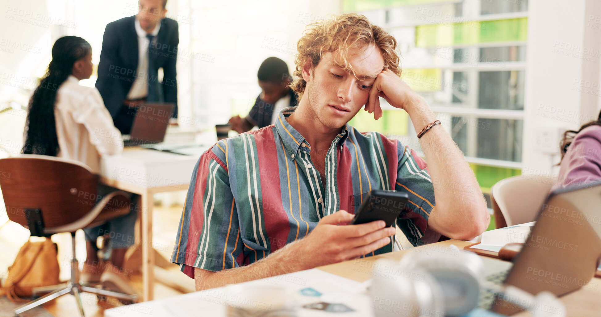 Buy stock photo Student, man and bored with phone in classroom, texting and distraction with social network at college. Person, smartphone and check notification with mobile app, laptop and email at university