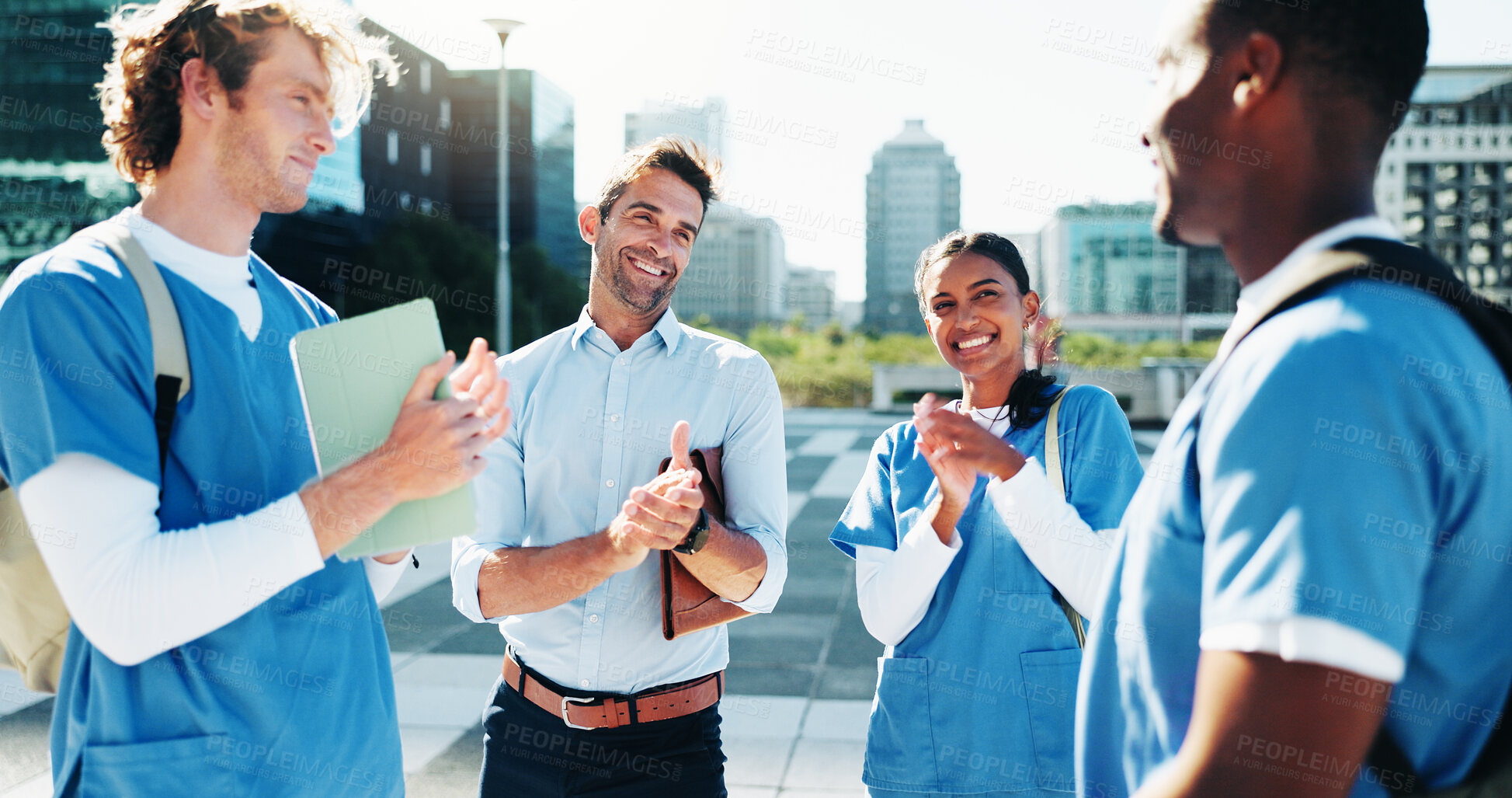 Buy stock photo Medical students, support and applause for success or celebrate residency completion. Healthcare nurse, happy group and people clap with lecturer for praise, congratulations or education goal in city