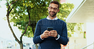 Buy stock photo Commuting, smile and man with smartphone, street and texting with tech for business, travel and online. Outdoor, happy and person with mobile for work, road and communication with app or morning