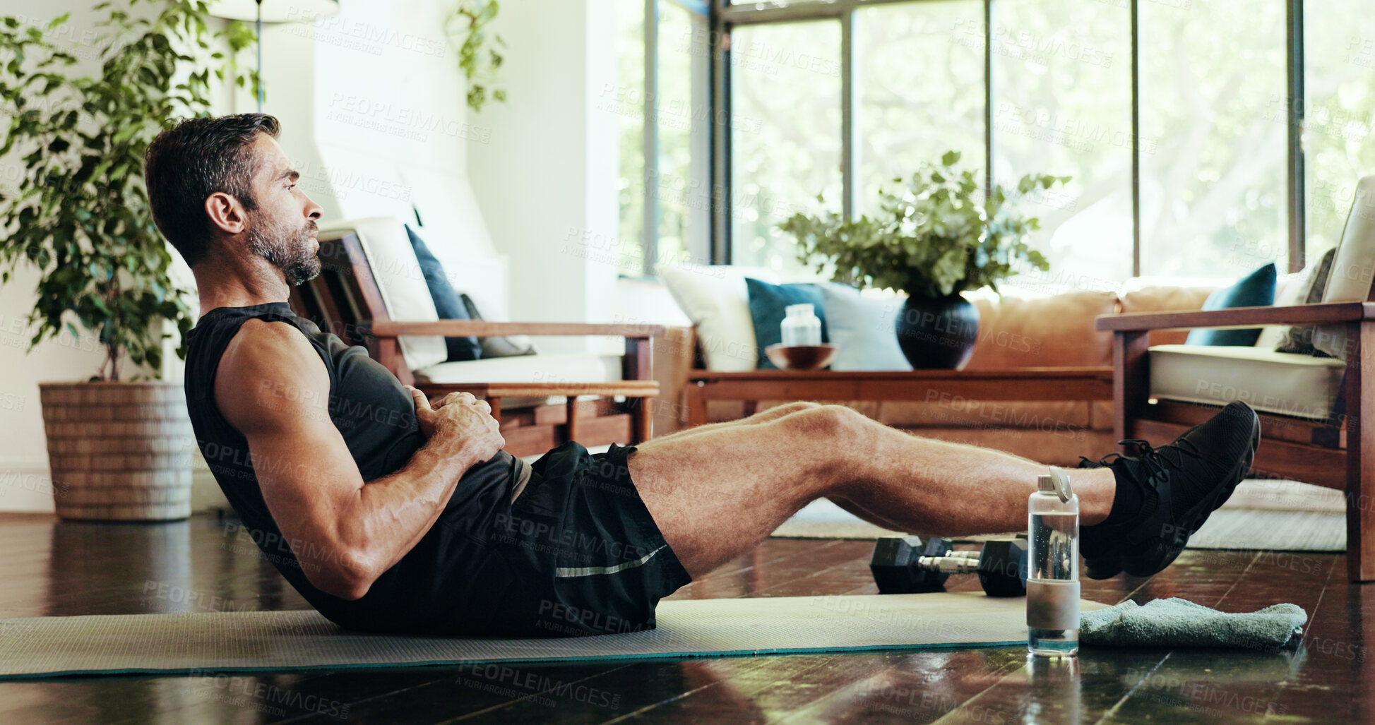 Buy stock photo Fitness, home and man with sit up for exercise, training and cardio workout on yoga mat. Morning routine, pilates and person for health, wellness and performance for core strength and challenge