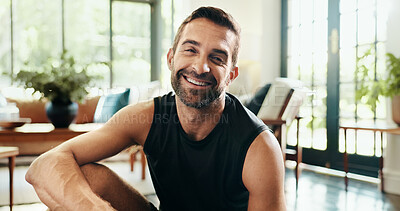 Buy stock photo Portrait, happy and man in living room, fitness and healthy in home, exercise and athlete with sportswear. Morning, routine and person on break for workout, wellness and smile in lounge in Canada