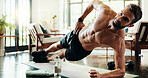 Plank, fitness and man in home, exercise and balance for core muscles in living room and stretching. Morning, training and person with routine in lounge, posture and wellness with workout in house