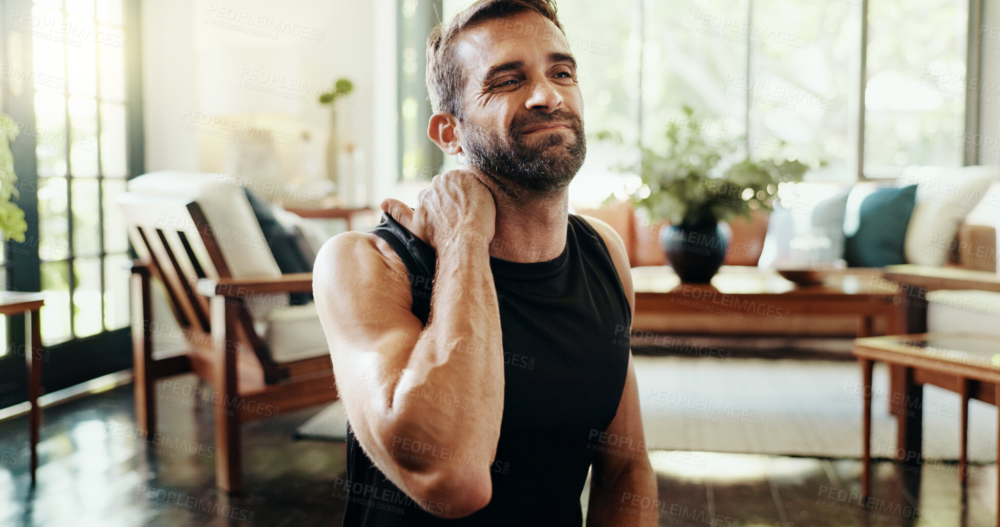 Buy stock photo Fitness, home and man with shoulder ache, injury or accident for intense workout with mistake. Sports, exercise ball and person with muscle sprain, discomfort or back pain for training error in house