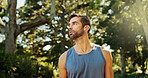 Thinking, active man and fitness outdoor with cardio exercise, endurance training and marathon. Male athlete, confidence and sports workout, running performance and earpods with listening to podcast