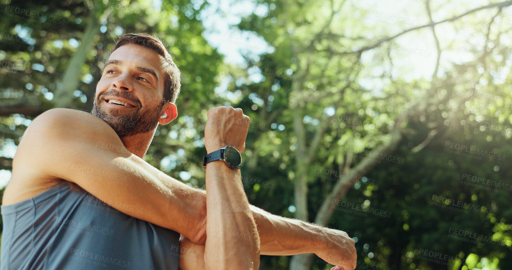 Buy stock photo Smile, man and stretching as runner outdoor with cardio exercise, endurance training and marathon. Below, warm up and fitness ready with sports workout, running performance and listening to podcast