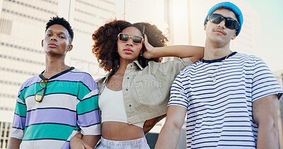 Buy stock photo Cool, streetwear and friends in city with fashion in summer for urban, edgy or trendy style together. Outdoor, gen z men and serious woman in town for youth culture, unique clothes or creative swag