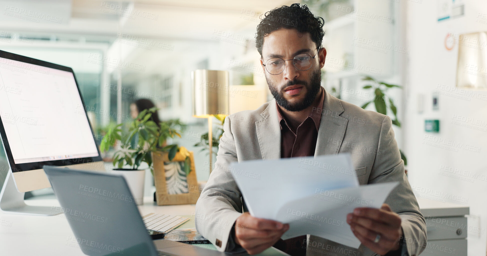 Buy stock photo Paperwork, laptop and businessman in office for research on stock market, revenue or dividend. Computer, email and male financial manager with profit documents for client investment proposal.