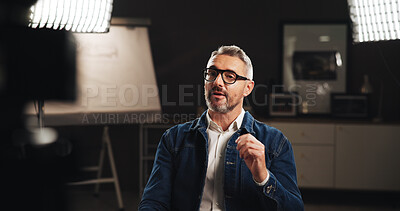 Buy stock photo Mature man, studio interview or talk with recording for project discussion or development process. Male person, civil engineer or building designer with broadcast or podcast for helpful tips or guide