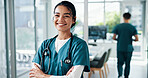 Nurse, woman or arms crossed with stethoscope at hospital for healthcare service, about us or career confidence. Medicine professional, happy doctor and portrait for health treatment and clinic care