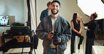 Camera, portrait and smile with photographer in studio for start of catalog or magazine photoshoot. Backstage, creative or media with makeup artist and model getting ready for photography on set