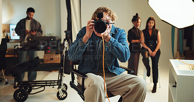 Buy stock photo Camera, focus and photography with man in studio for photoshoot, preparation or shooting. Backstage, creative or media and photographer on set with makeup artist and model getting ready for film