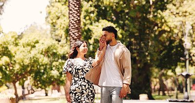 Buy stock photo Holding hands, smile and couple on date, park and romance for people in nature, kiss or happy for walk. Outdoor, man and affection for woman, love and together for valentines day, care and commitment
