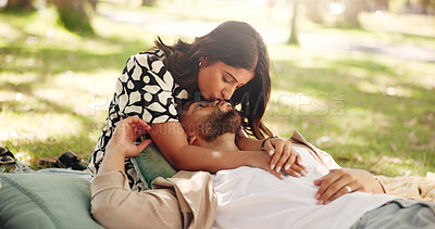Buy stock photo Bonding, kiss and couple on date, picnic and affection for man in nature, embrace or relationship. Relax, park and romance with woman on anniversary, people and together for break, weekend or outdoor