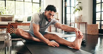 Buy stock photo Man, exercise and leg stretching in home for warm up, workout or fitness for training or muscle. Endurance, goal and athlete person for cardio, wellness and balance on floor with mat for challenge