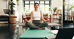 Laptop, meditation and smile with woman in living room of home for health, pilates or wellness routine. Exercise, online course and yoga with happy Indian person in apartment for holistic balance