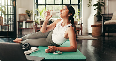 Buy stock photo Drinking water, fitness and laptop  with woman in home for exercise, hydration or wellness workout. Bottle, relax and pilates with thirsty person in apartment living room for online training course