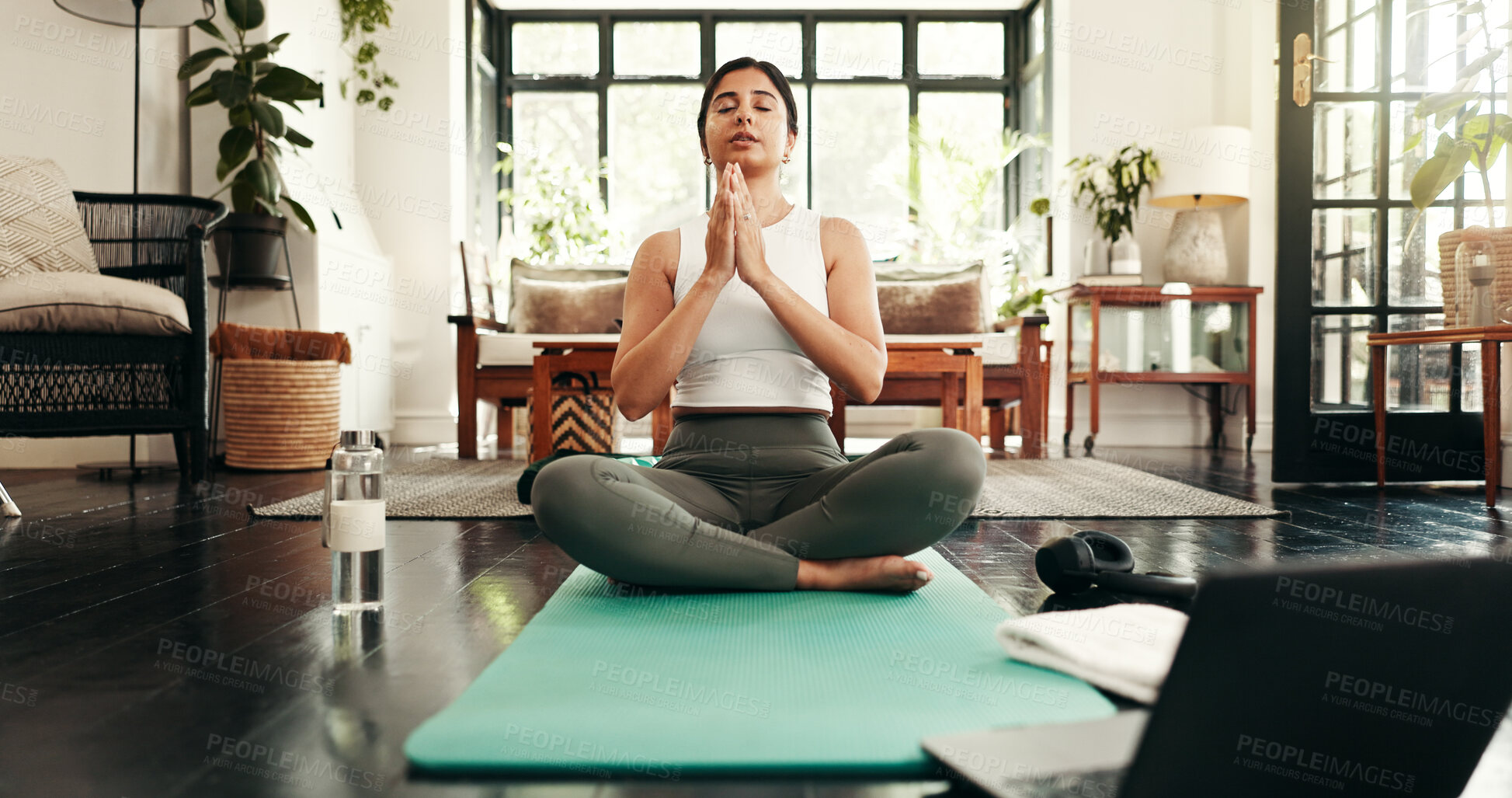 Buy stock photo Fitness, laptop and meditation with woman in living room of home for health, pilates or wellness routine. Exercise, online course and yoga with Indian person on floor of apartment for mindful balance