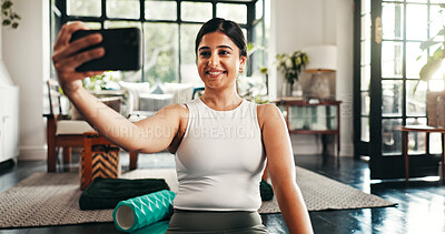 Buy stock photo Fitness, selfie and yoga with happy woman in living room of home for health, pilates or wellness routine. Exercise, holistic and smile with Indian person on floor of apartment for social media