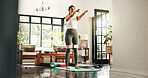 Fitness, woman and resistance band on legs in home for hamstring training, workout glutes or balance for health. Exercise, muscle and person with body strength, stretching and wellness for pilates