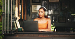 Student, headphones and laptop with woman in cafe on campus for college research, education or learning portal. University website, music and typing with person in restaurant for online scholarship