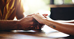 Closeup, couple and holding hands with love for support, respect and bonding together with trust in marriage. Restaurant, man and woman with compassion for hope, connection or commitment with care