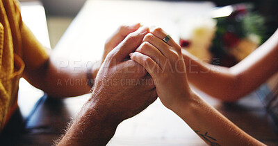 Buy stock photo Love, couple and holding hands for support, trust and care on date together in restaurant. Closeup, table and comfort with people for relationship, commitment and romantic connection with partner