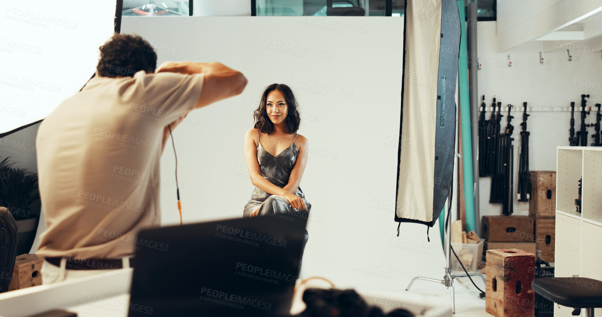 Buy stock photo Photoshoot, photographer and woman in studio, creative and pictures for fashion magazine and production. Backstage, artist and group with project for media agency, camera or equipment for photography