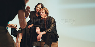 Buy stock photo Photoshoot, photographer and couple in studio, creative and pictures for fashion magazine and production. Behind the scenes, digital and people with project for media agency, camera and photography