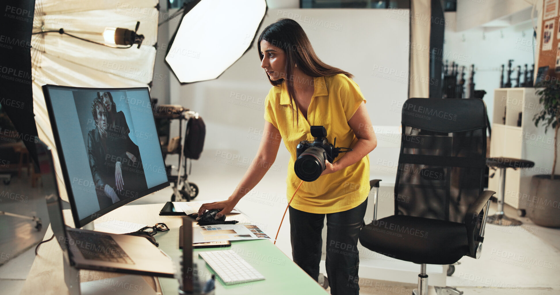 Buy stock photo Editing, photographer and woman with camera, computer and creative for project in studio or serious. Business, artist and person with tech for photography, post production and choice of picture